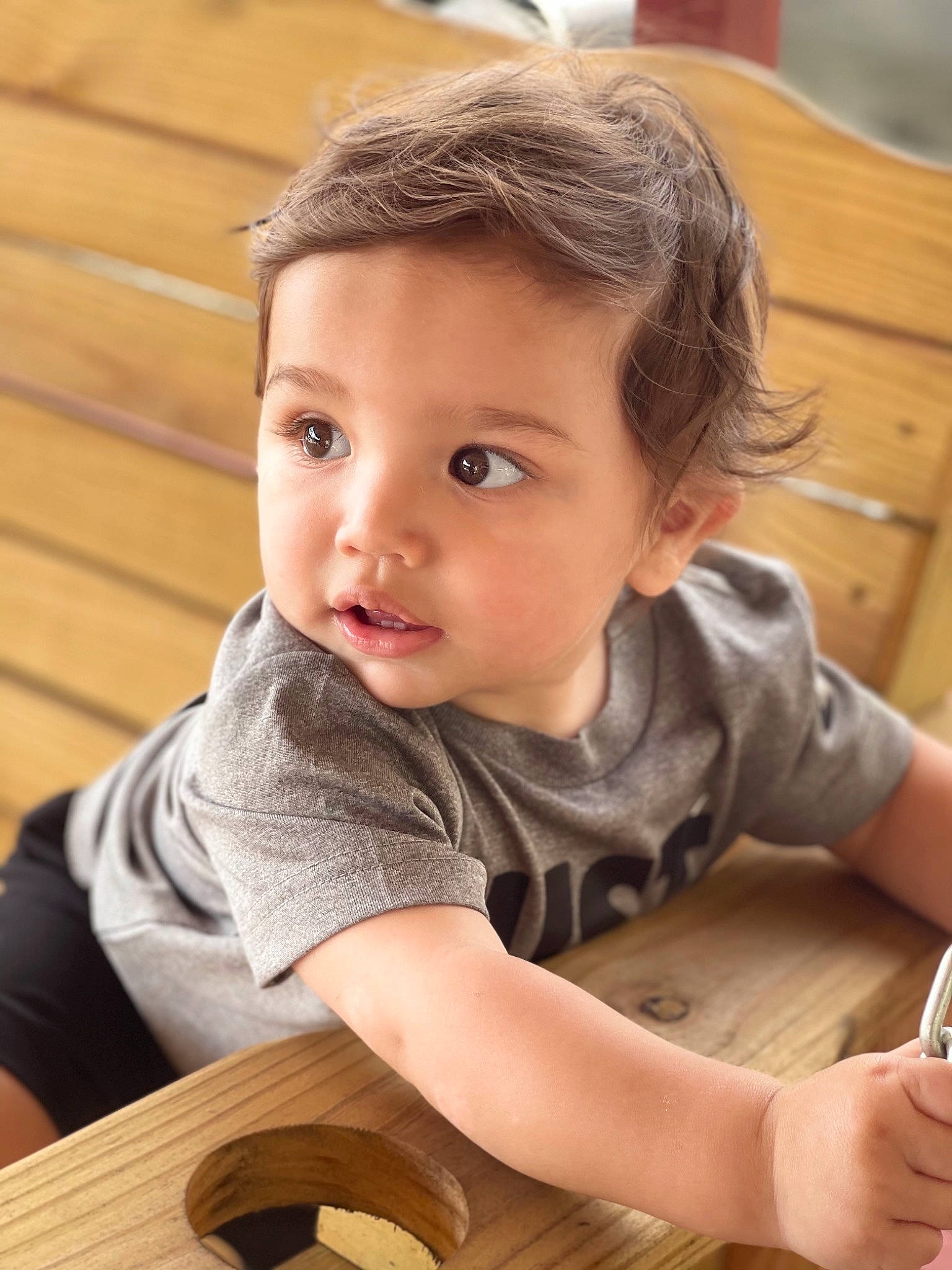 Marcello joined the competition — help win amazing prizes! baby_toddler_clothing, chair, child, dress, finger, flooring, fun, hand, happy, hardwood, human, mobile_phone, people, person, product, sitting, skin, tableware, toddler, tree