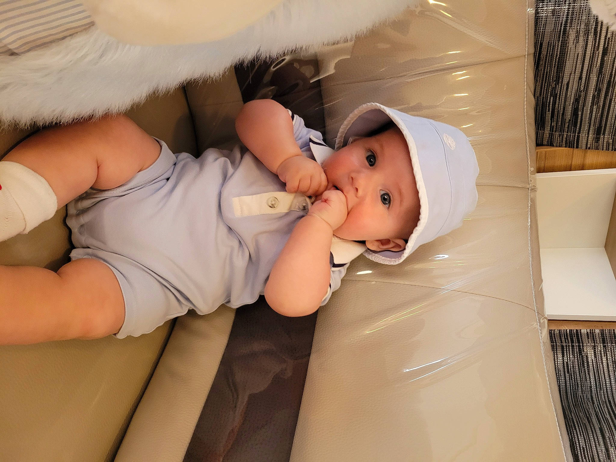 Connor participe au concours pour gagner de l'argent avec cette photo : abdomen, baby, baby_products, baby_sleeping, baby_toddler_clothing, child, comfort, diaper, elbow, happy, hat, headgear, headwear, human_leg, knee, mouth, person, room, skin, thigh
