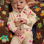 Lilyuana is registered to the contest to win money with this photo: baby, child, hoodie, clothing, pattern, cherry, pillow, owl, colorful, cute, expression, face, hand, sitting, infant, indoors, fabric, soft, playful, portrait