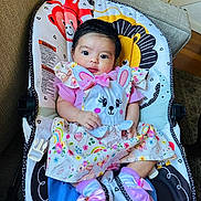 Loaiza joined the competition — help win amazing prizes! baby, infant, child, cute, colorful_clothing, bunny_theme, pink, socks, bow, baby_seat, animal_print, smiling, indoor, portrait, playful, comfort, happy, person, face, young_child