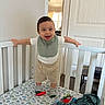 Ricardo joined the competition — help win amazing prizes! toddler, crib, baby, child, smiling, toy, bedding, dinosaur_pattern, sock, bib, shorts, white_crib, indoor, window, door, carpet, plush_toy, clothing, happy, room