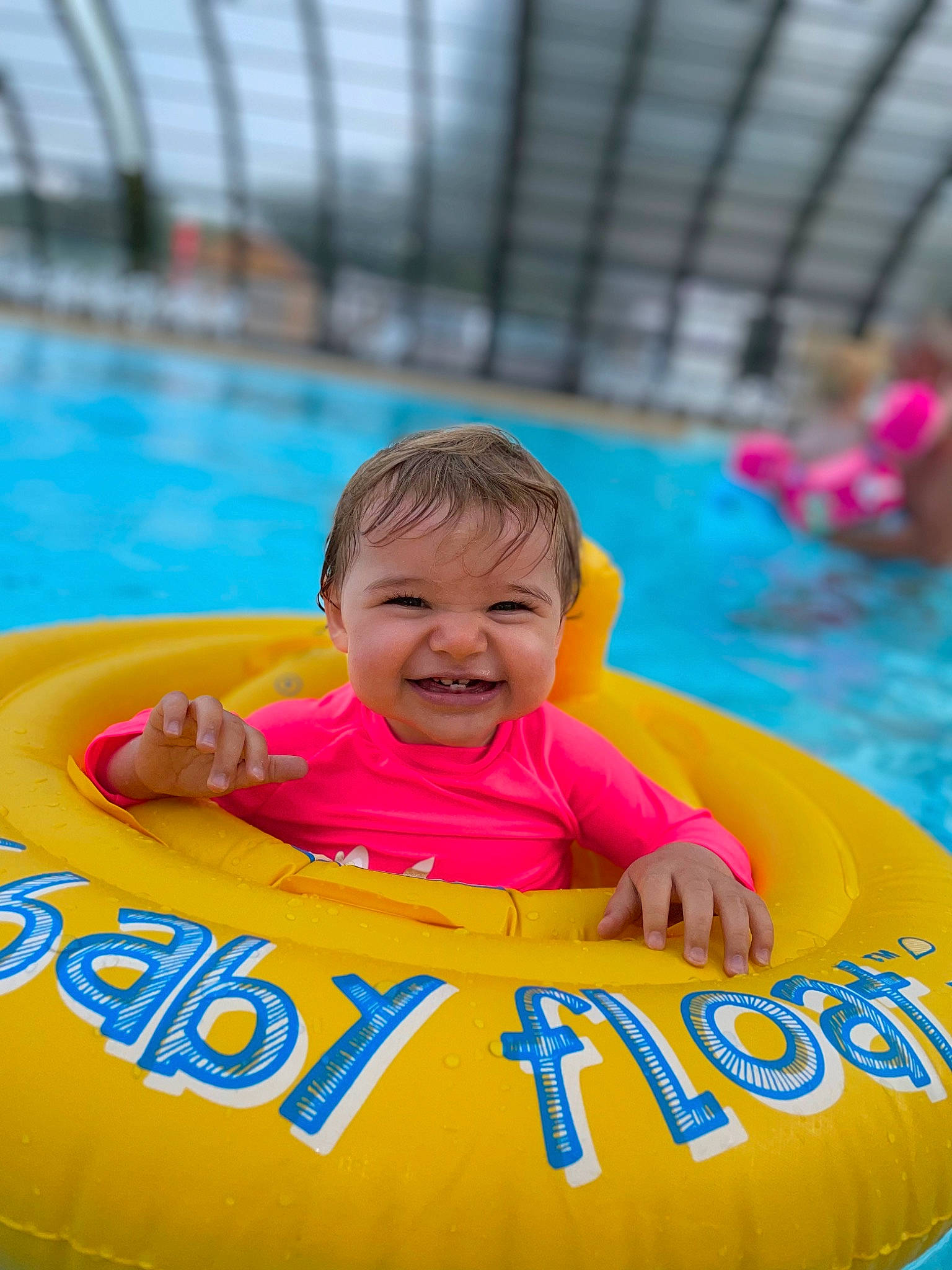 Maddy participe au concours pour gagner de l'argent avec cette photo : aqua, baby, baby_float, baby_toddler_clothing, child, fun, happy, inflatable, joy, leisure, nonbuilding_structure, outdoor_recreation, person, personal_protective_equipment, product, recreation, smile, swimming_pool, toddler, tubing