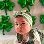 Hazel joined the competition — help win amazing prizes! adorable, baby, background_blur, balloons, bow, cheeks, close_up, clover, cute, eyes, green_balloon, headband, infant, onesie, portrait, shamrock, skin, soft_lighting, st_patricks, tummy_time