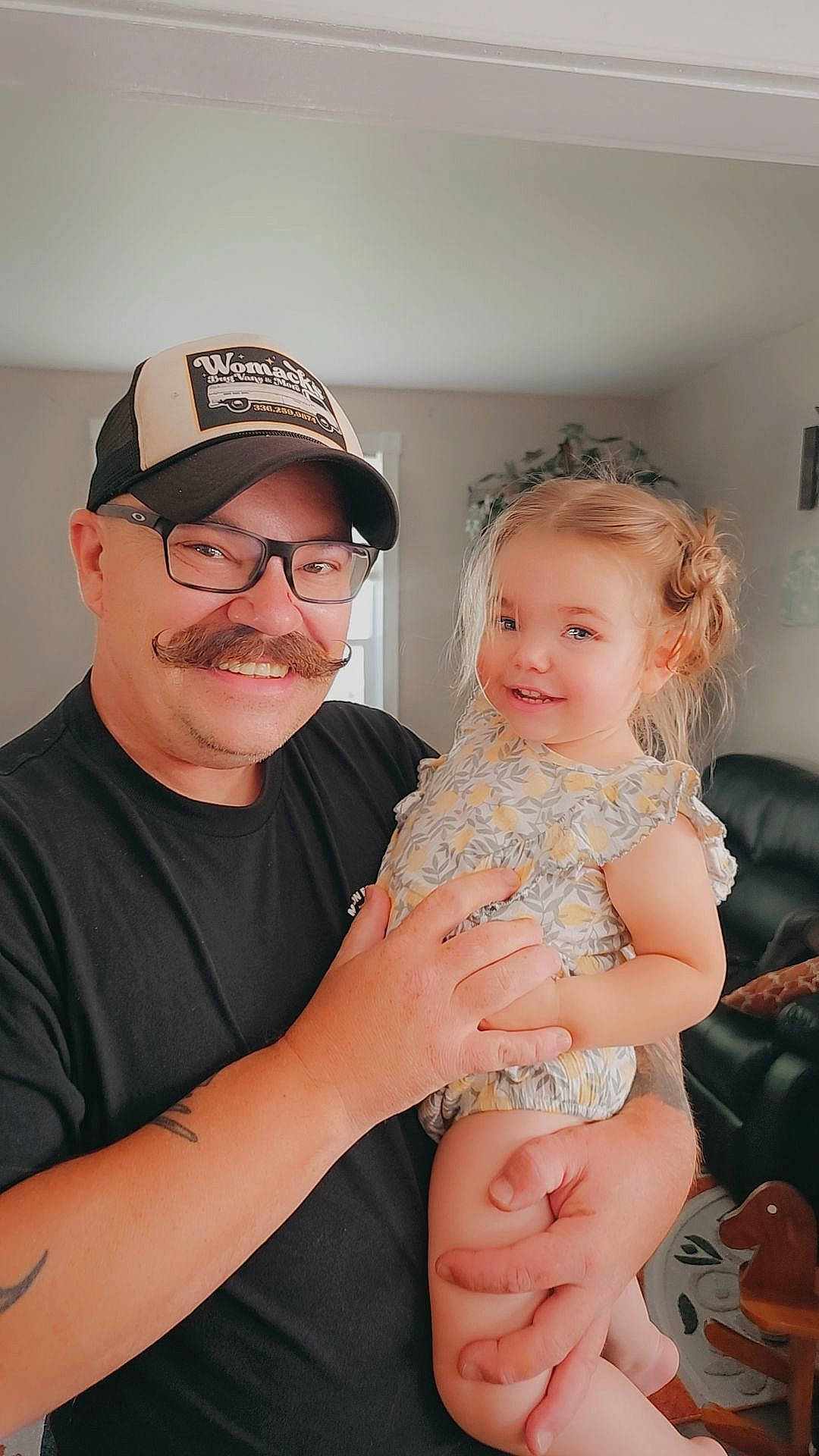 Hopelynn is registered to the contest to win money with this photo: abdomen, arm, baby, baby_toddler_clothing, baseball_cap, cap, event, eyewear, finger, gesture, happy, headwear, joy, nail, person, picture_frame, shoulder, skin, smile, thumb