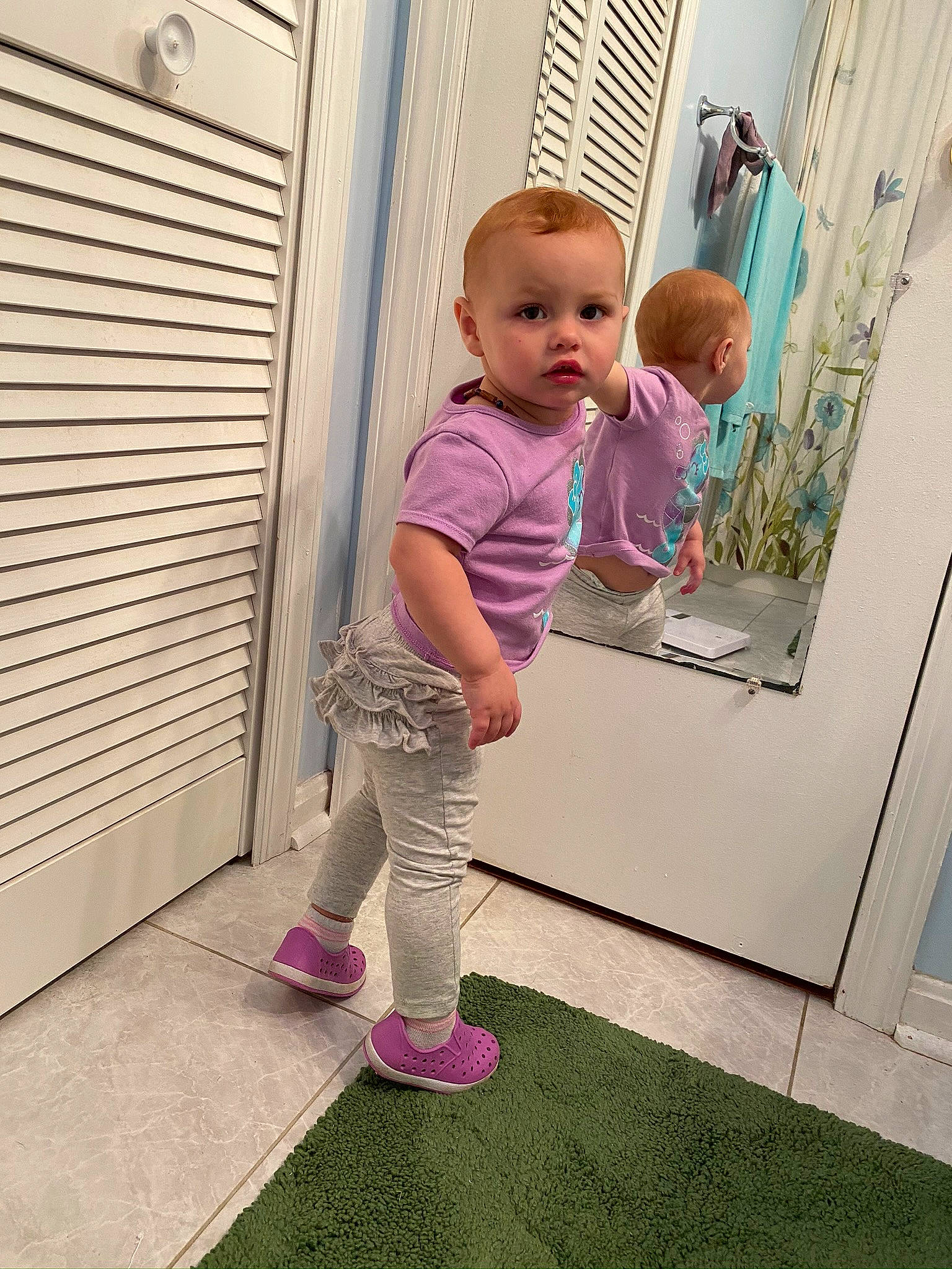 Emilee is registered to the contest to win money with this photo: baby, child, floor, flooring, leg, person, pink, play, room, shoe, standing, toddler, vacation