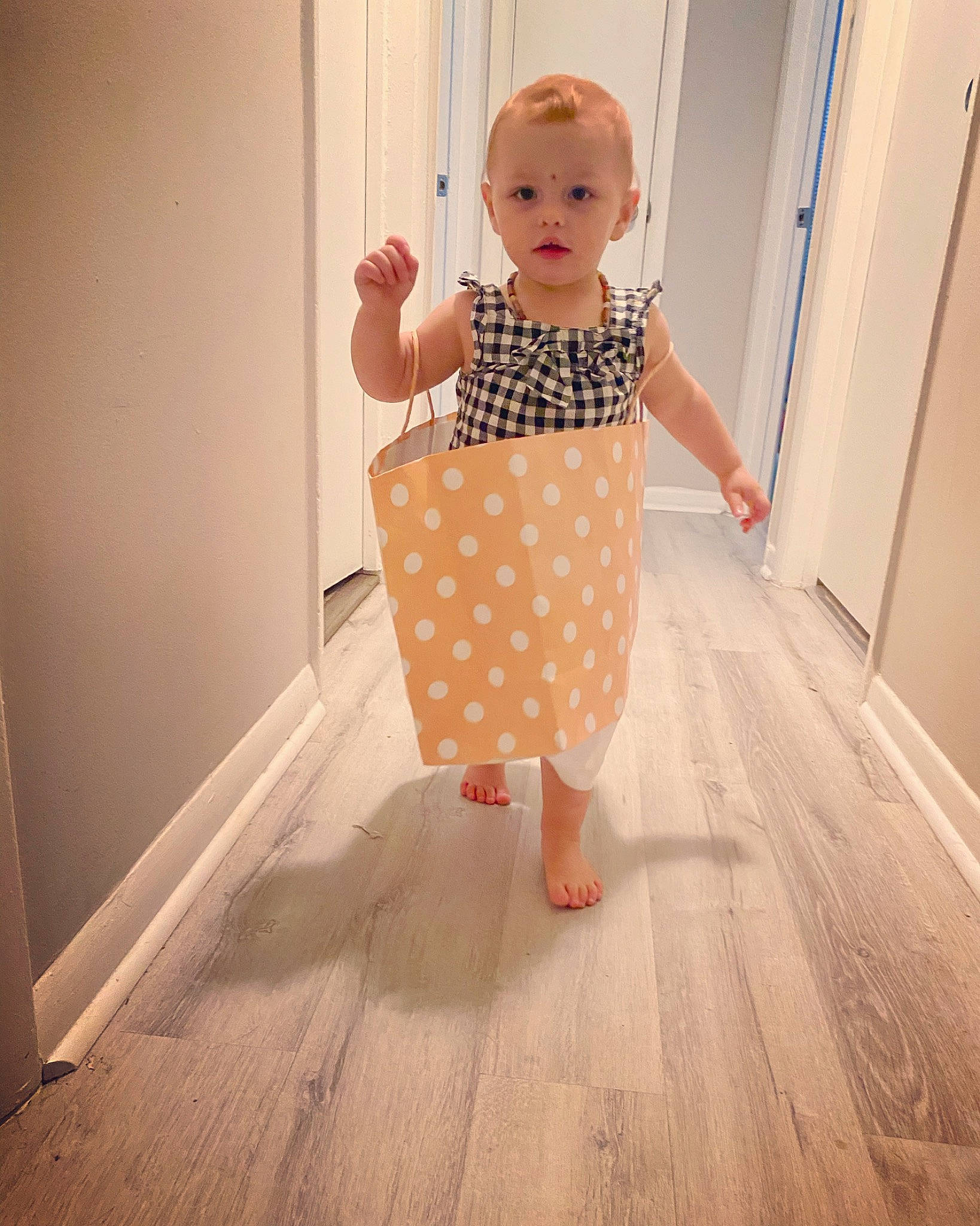 Emilee is registered to the contest to win money with this photo: baby_toddler_clothing, child, clothing, design, dress, floor, flooring, footwear, pattern, peach, person, pink, polka_dot, product, shoe, shoulder, skin, standing, toddler, yellow