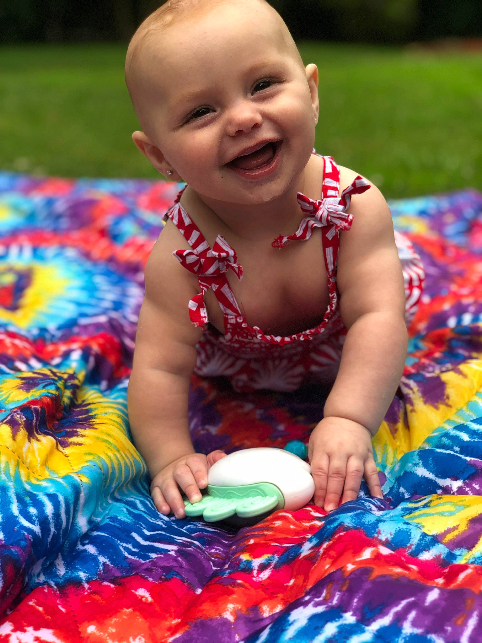 Emilee is registered to the contest to win money with this photo: baby, baby_products, child, fun, games, grass, happy, joy, leisure, party, person, picnic, play, product, recreation, sitting, smile, summer, toddler, tummy_time