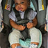 baby, car_seat, child, infant, sneakers, clothing, seatbelt, cute, portrait, indoor, person, young_child, sitting, casual, comfort, striped_shirt, footwear, expression, baby_boy, safety