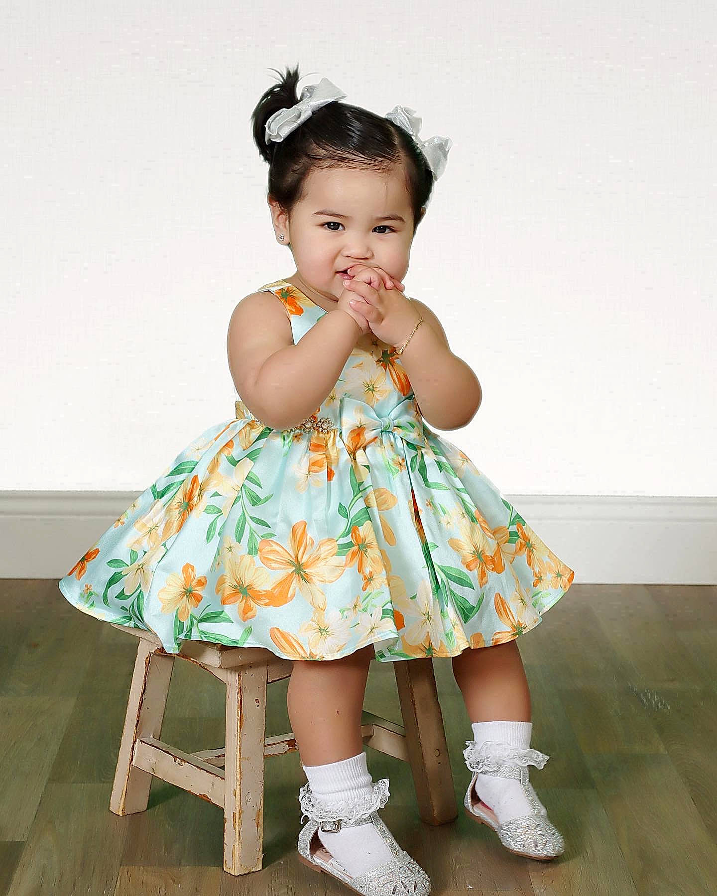 Alaia is registered to the contest to win money with this photo: arm, baby_toddler_clothing, child, clothing, day_dress, dress, fashion_design, flash_photography, formal_wear, fun, hair, happy, headpiece, human_body, one_piece_garment, pattern, person, ruffle, sleeve, sock