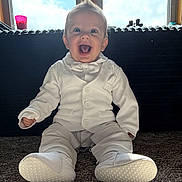 Leo joined the competition — help win amazing prizes! baby, child, smiling, white_suit, bow_tie, indoor, carpet, window, sunlight, happy, portrait, sitting, footwear, cute, hairstyle, infant, one_person, clothing, fashion, face
