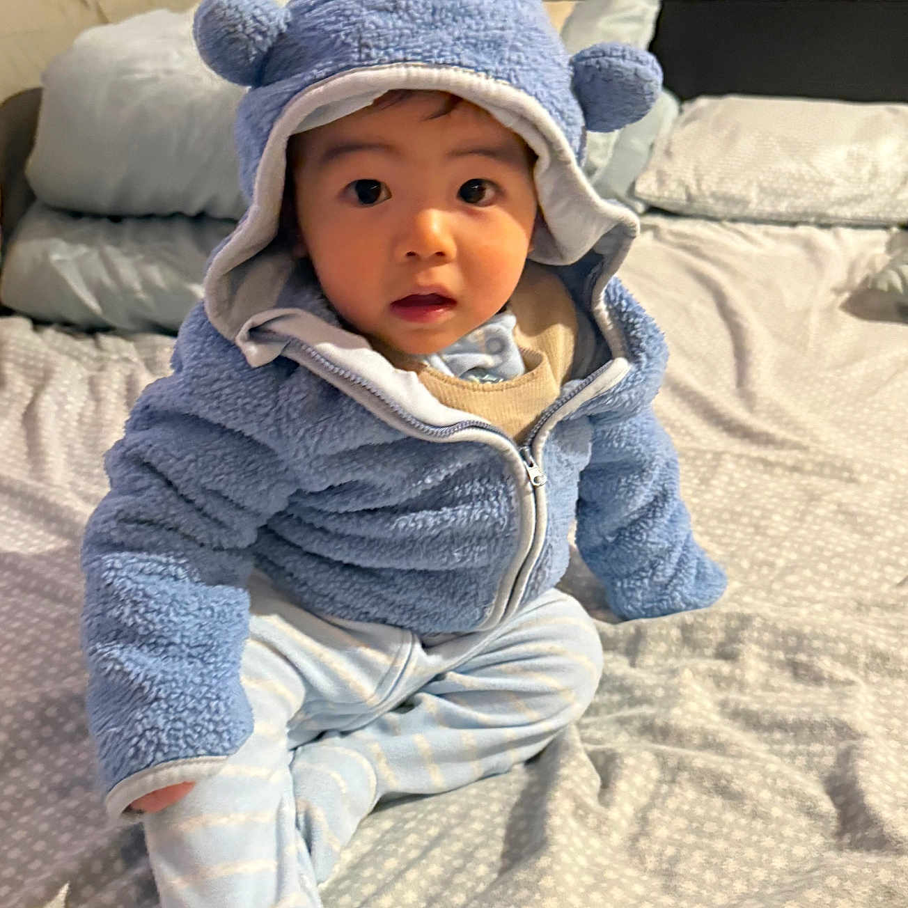 Leo joined the competition — help win amazing prizes! baby, bed, blanket, bonnet, cap, clothing, crawling, face, hat, head, hood, hoodie, knitwear, pants, person, photography, portrait, sitting, sweater, sweatshirt
