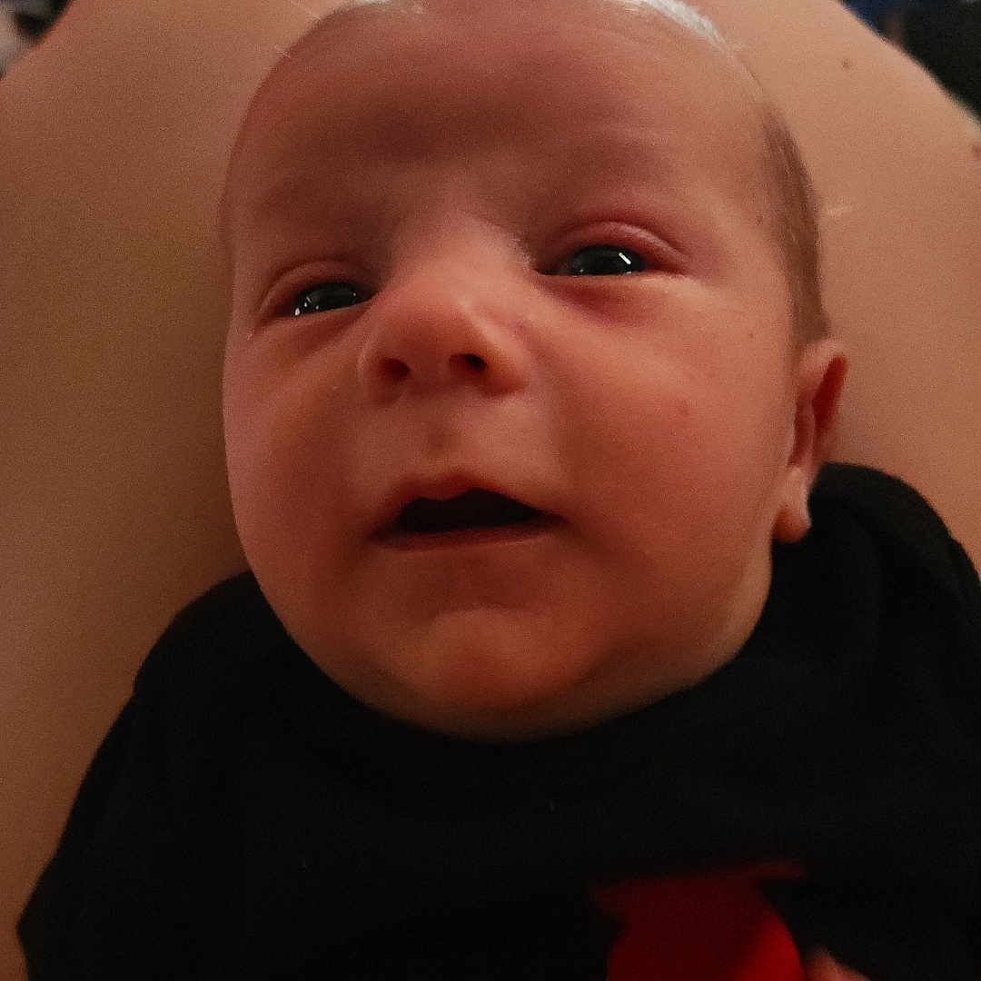 Julian joined the competition — help win amazing prizes! baby, bodypart, ear, face, finger, frown, hand, head, mouth, newborn, person, photography, portrait, sad