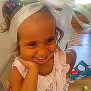 Tiarlee is registered to the contest to win money with this photo: accessories, bodypart, child, clothing, couch, dress, face, female, furniture, girl, happy, hat, head, indoors, mouth, person, photography, portrait, smile, teeth