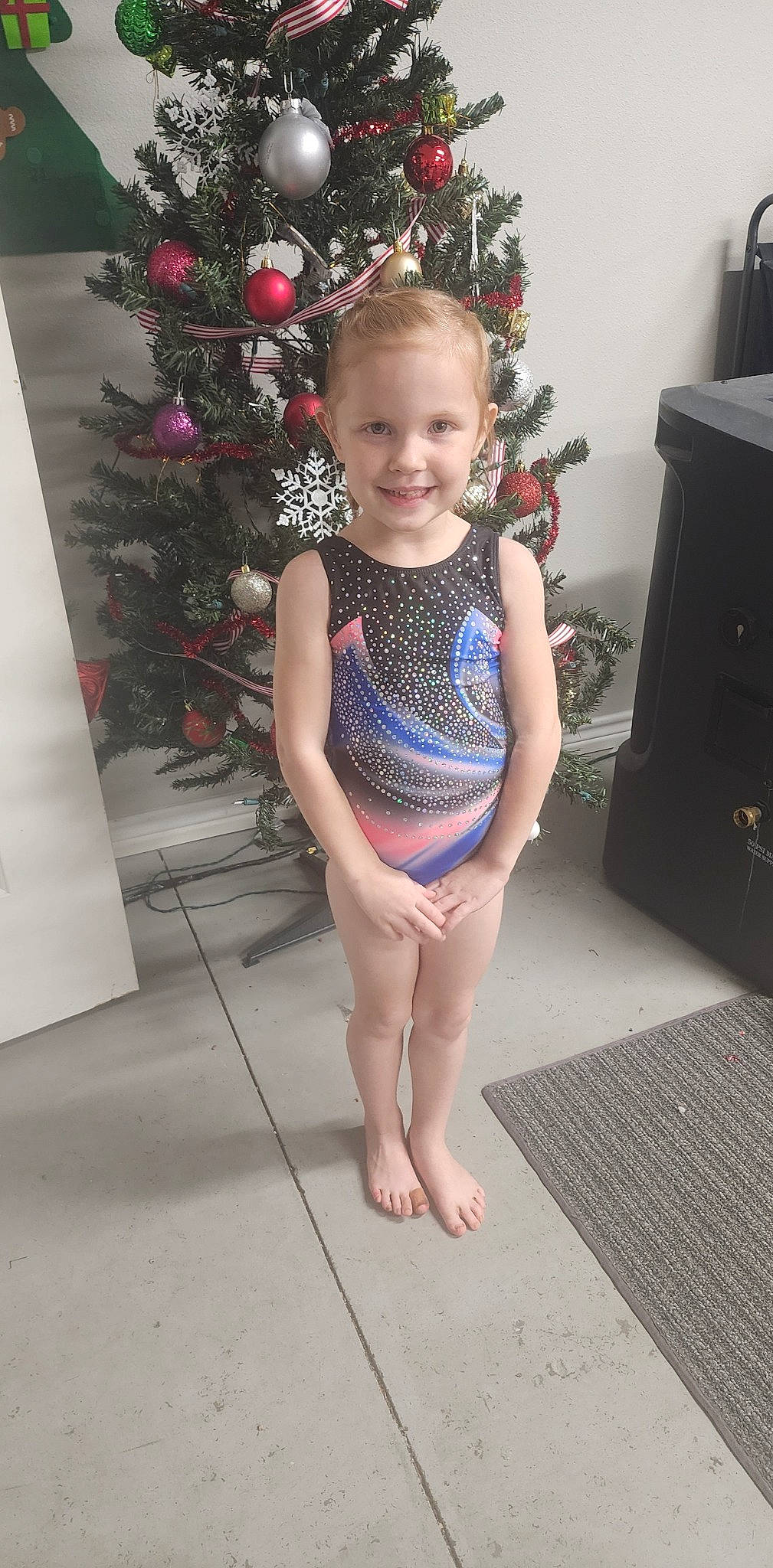 Grace joined the competition — help win amazing prizes! abdomen, baby_toddler_clothing, barefoot, christmas_tree, event, face, flooring, happy, human_leg, joy, leg, pattern, person, pink, plant, sleeve, smile, standing, thigh, toddler