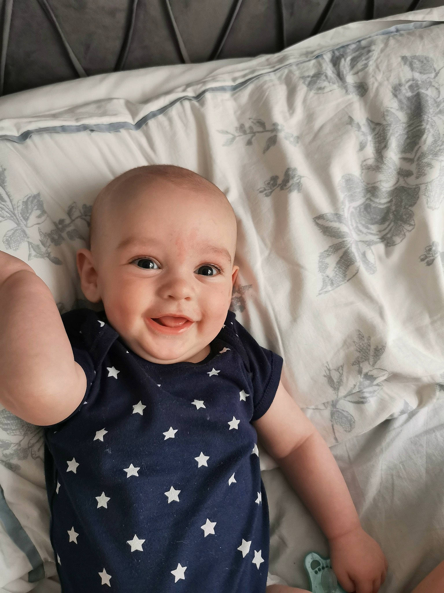 Vinnie is registered to the contest to win money with this photo: baby, baby_toddler_clothing, cheek, child, comfort, eye, happy, head, iris, joy, linens, pattern, person, photograph, product, skin, sleeve, smile, t_shirt, textile