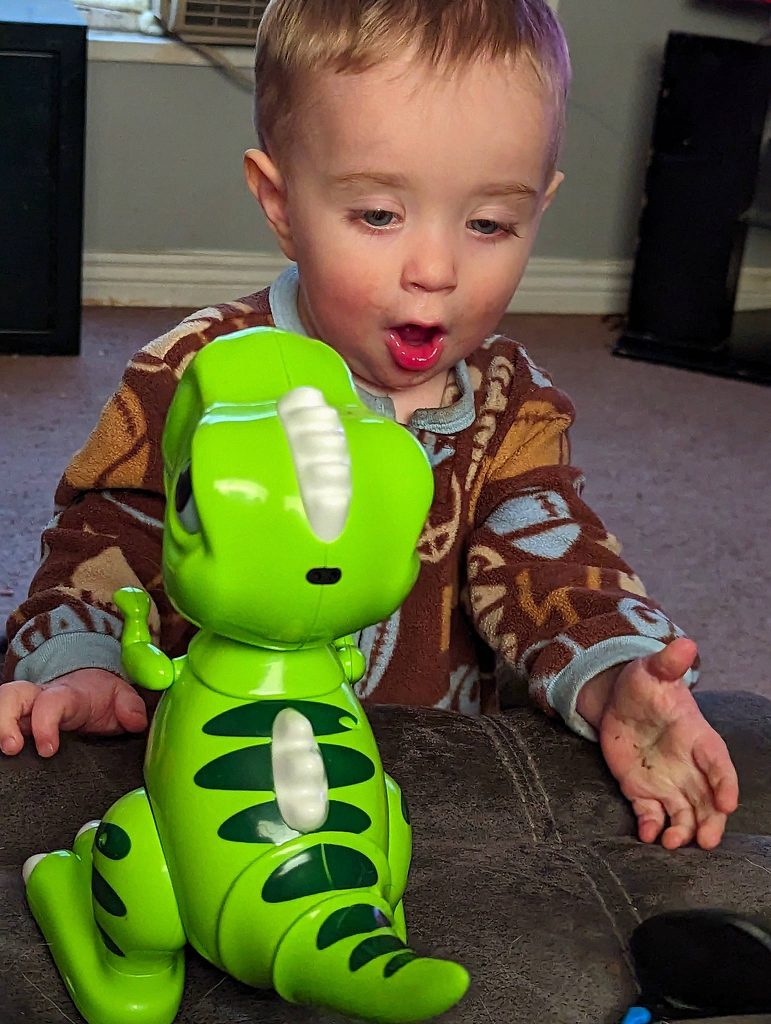 Atreyu is registered to the contest to win money with this photo: baby, baby_toddler_clothing, cabinetry, child, cool, facial_expression, flooring, fun, hairstyle, happy, head, mouth, nose, person, product, sitting, skin, stuffed_toy, thumb, toddler