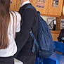 Crackwhore is registered to the contest to win money with this photo: child, boy, school_uniform, backpack, classroom, locker, poster, desk, chair, blue_chair, student, profile_view, short_hair, conversation, schoolbag, uniform, indoor, education, wooden_cabinet, casual_clothing