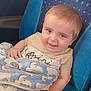 George joined the competition — help win amazing prizes! baby, child, blanket, blue, seat, smile, face, hand, clothing, pattern, elephant, cute, infant, toddler, indoor, portrait, comfort, young, happy, person