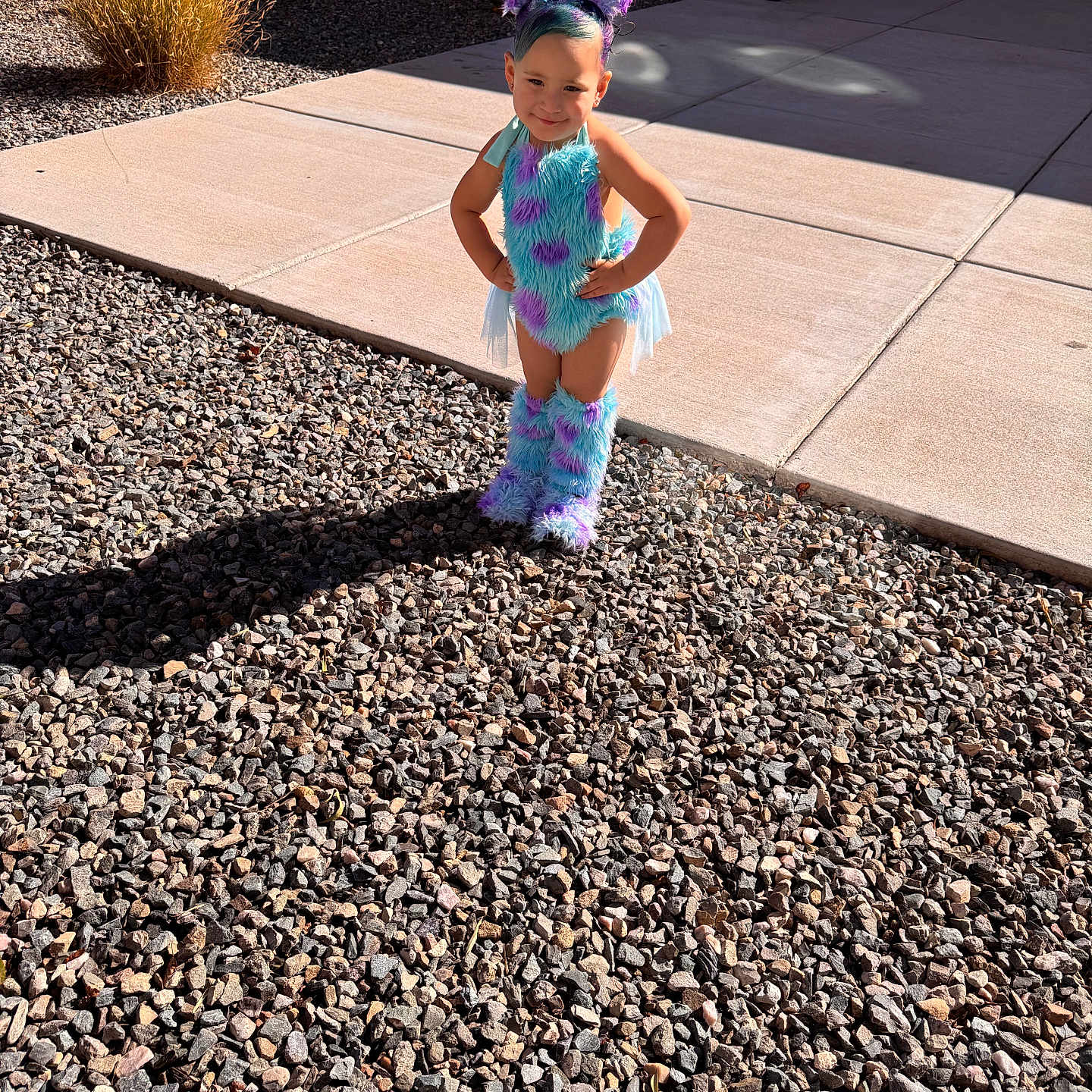 Amirah is registered to the contest to win money with this photo: car, child, clothing, dress, face, female, flagstone, girl, gravel, head, path, pebble, person, photography, portrait, road, soil, transportation, vehicle, walkway