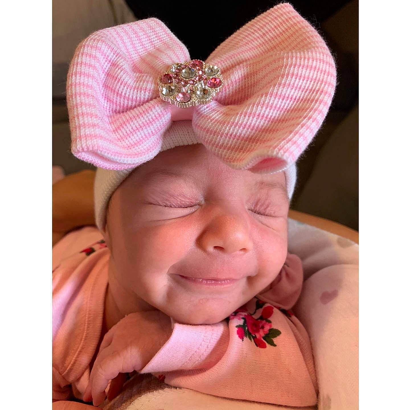 Liliana is registered to the contest to win money with this photo: baby, baby_toddler_clothing, cap, comfort, ear, fashion_accessory, hair_accessory, happy, head, headband, headgear, headpiece, headwear, jewellery, magenta, neck, nose, person, petal, pink