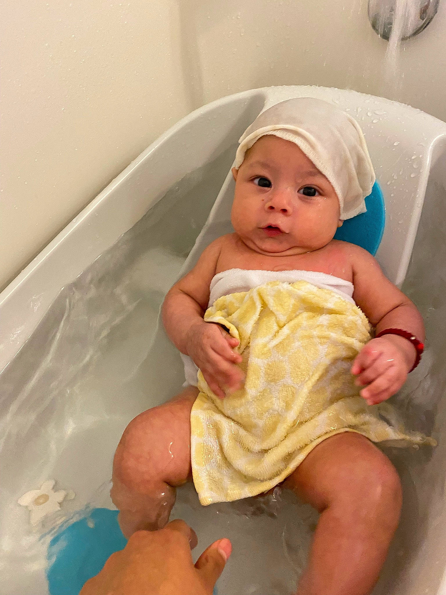 Mateo Jesse Clinkenbeard is registered to the contest to win money with this photo: baby, baby_toddler_clothing, bathing, bathroom, bathtub, cheek, comfort, dress, event, eye, fluid, fun, hat, headgear, headwear, human_body, person, pink, plumbing, skin