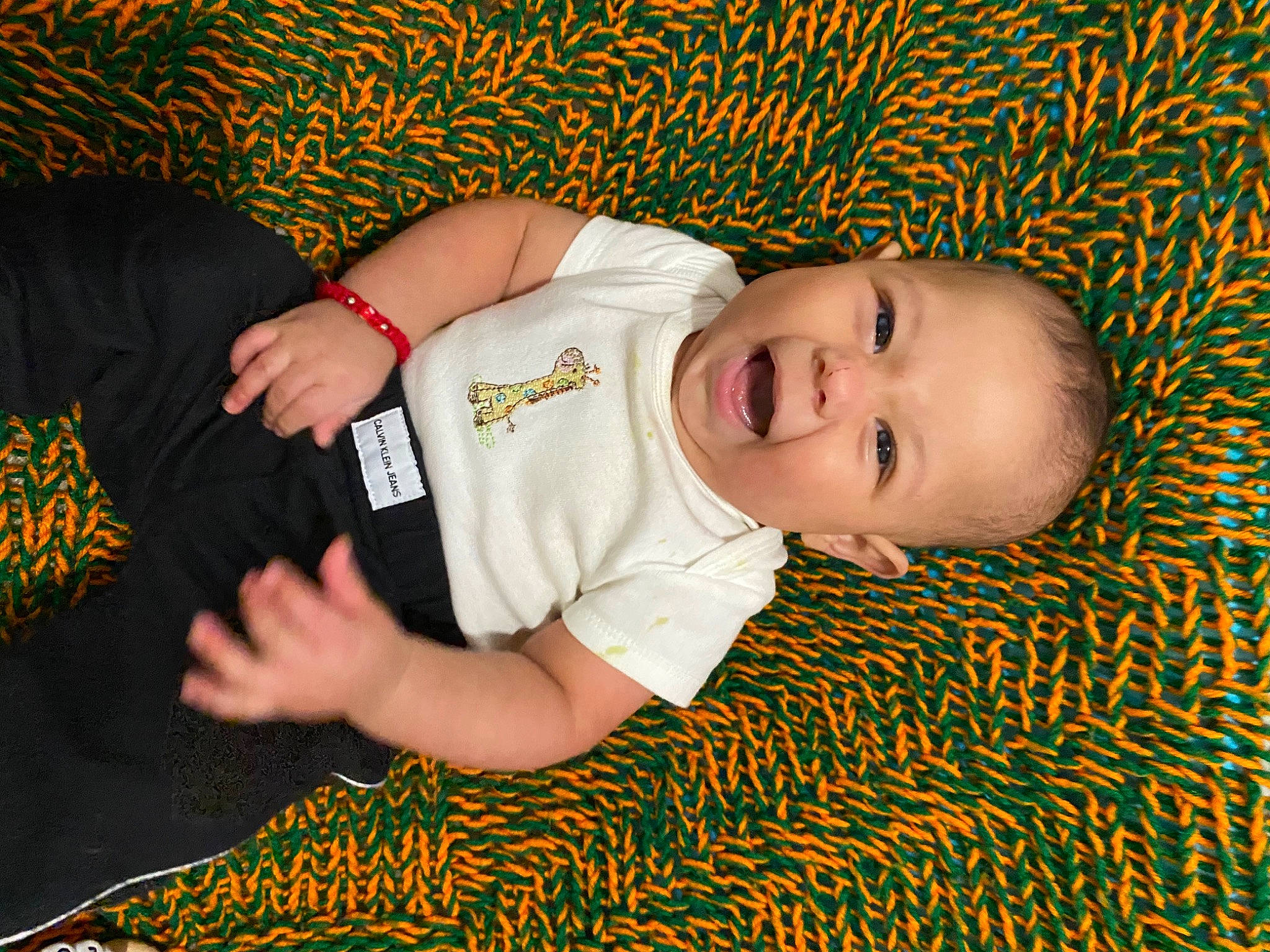 Mateo Jesse Clinkenbeard joined the competition — help win amazing prizes! baby, baby_toddler_clothing, cheek, child, comfort, elbow, eye, facial_expression, finger, flooring, fun, grass, happy, pattern, people_in_nature, person, skin, sleeve, smile, toddler