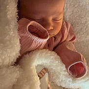 Aurora joined the competition — help win amazing prizes! baby, newborn, sleeping, blanket, pink_clothing, cozy, soft, infant, cute, peaceful, face, child, warm, rest, portrait, closeup, toddler, snuggle, bedtime, comfort