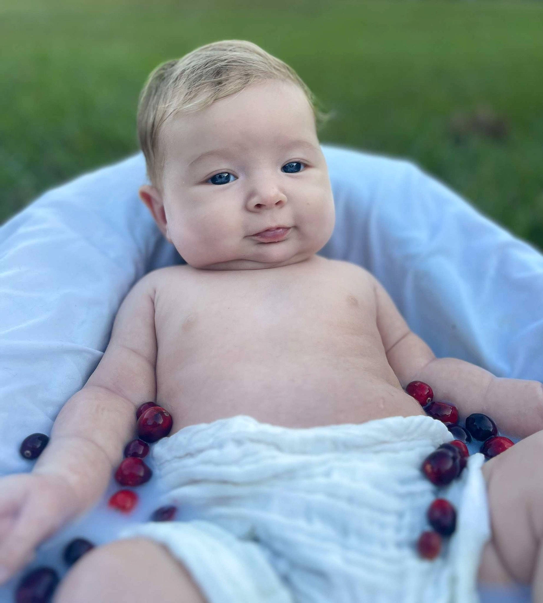 Reighn joined the competition — help win amazing prizes! baby, baby_toddler_clothing, cheek, child, eye, finger, fun, grass, happy, head, human_body, leisure, pattern, people_in_nature, person, plant, sitting, skin, summer, thumb