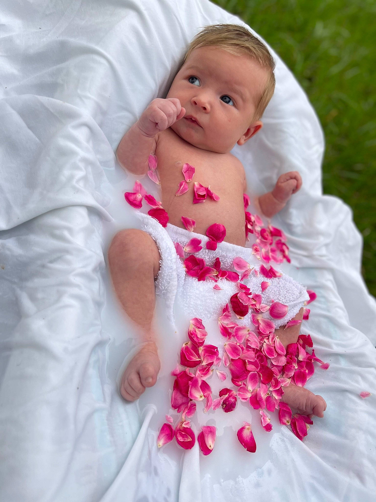 Reighn is registered to the contest to win money with this photo: arm, baby, baby_toddler_clothing, bridal_accessory, bridal_clothing, dress, event, face, finger, flash_photography, flower, gesture, hand, happy, person, petal, pink, skin, sleeve, textile