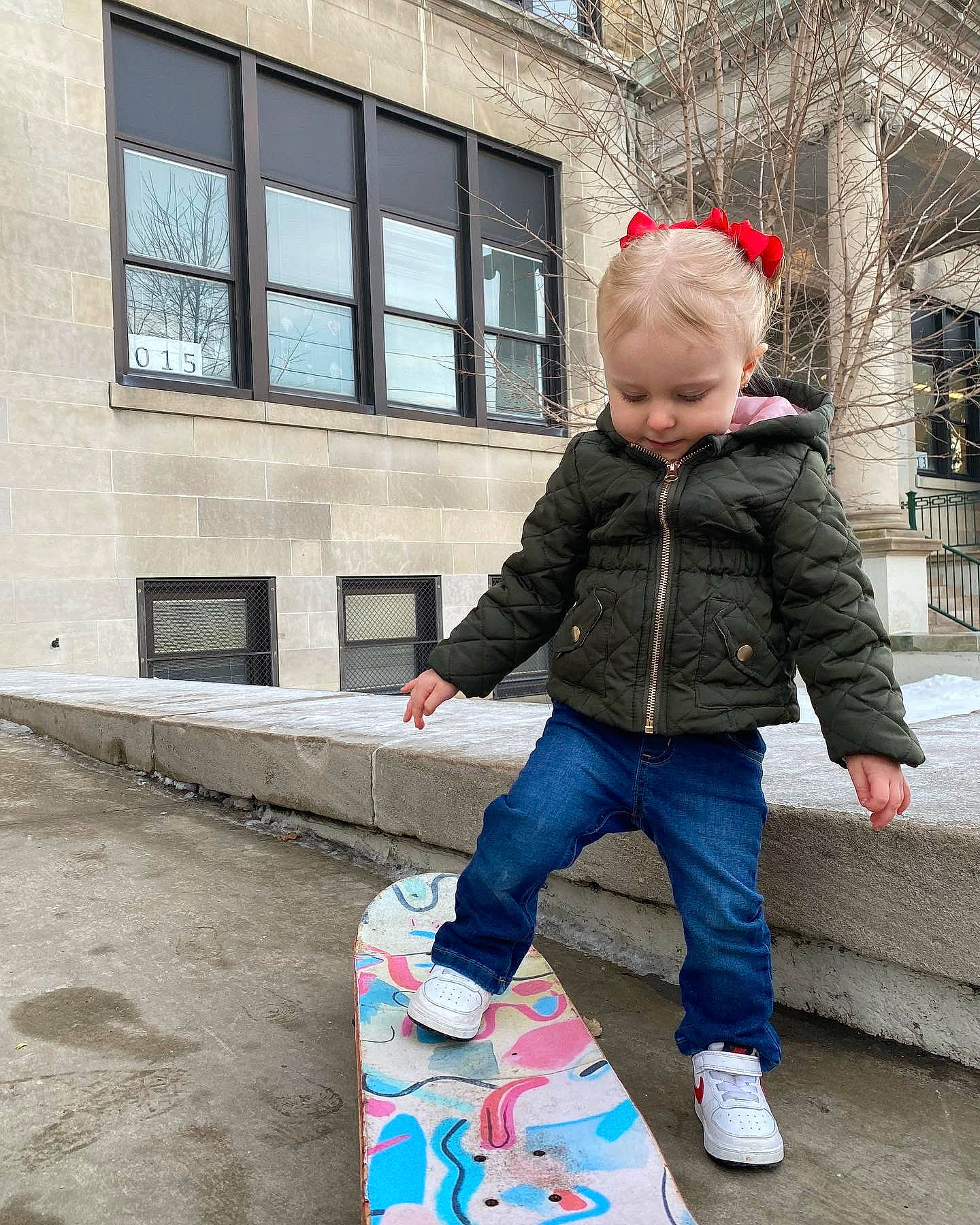 Mira joined the competition — help win amazing prizes! building, city, denim, electric_blue, flooring, fun, jacket, jeans, leisure, pattern, pedestrian, person, public_space, recreation, sidewalk, street, street_fashion, textile, toddler, window