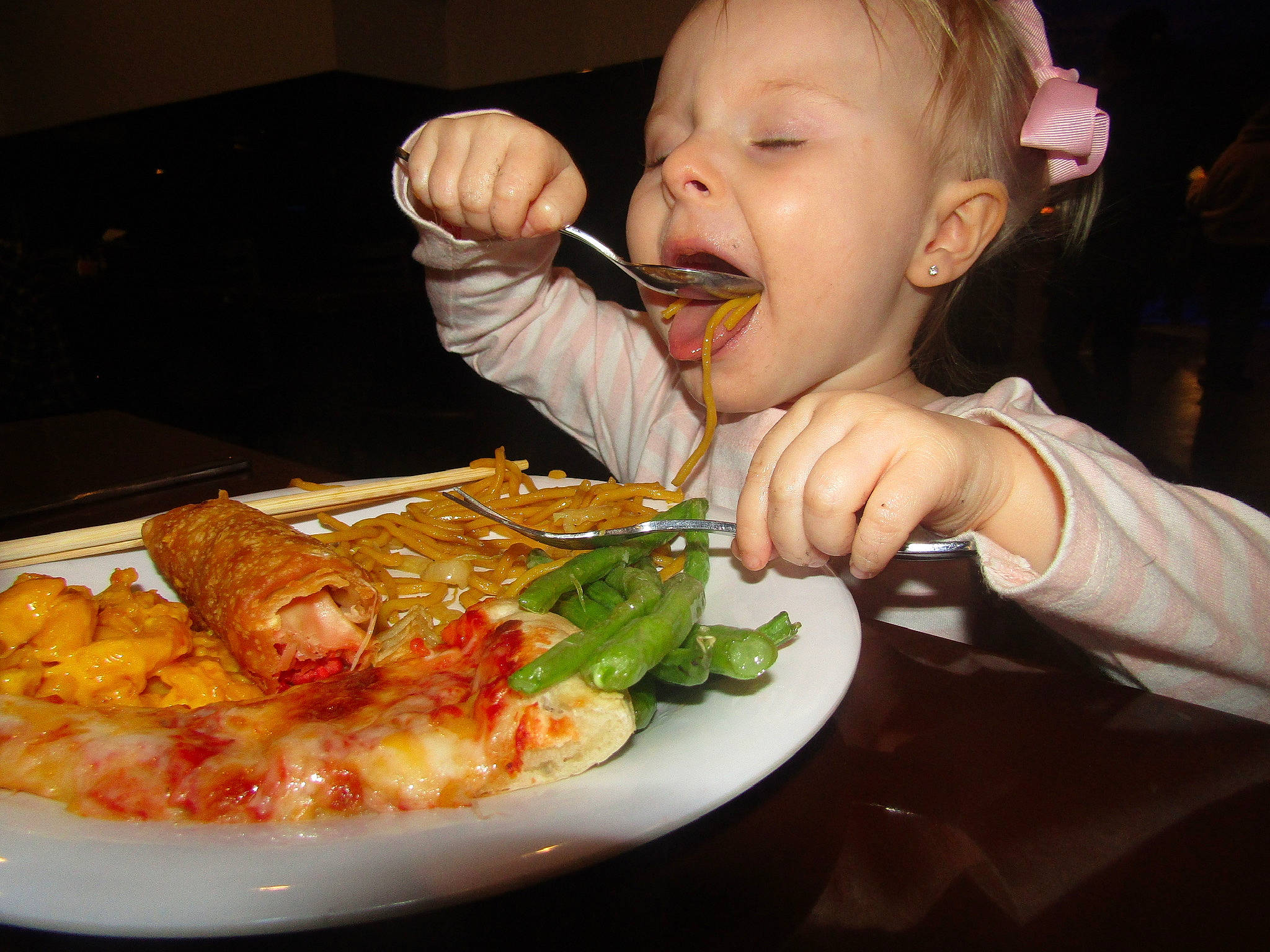 Mira is registered to the contest to win money with this photo: baby, biting, chair, comfort_food, computer_keyboard, cuisine, dish, food, food_craving, fork, ingredient, junk_food, meat, person, plate, produce, recipe, sharing, table, tableware