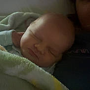 Ronnie joined the competition — help win amazing prizes! adult, baby, blanket, child, closeup, clothing, comfort, cozy, cuddle, face, head, indoor, infant, peaceful, person, portrait, rest, sleeping, soft, warm