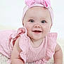 baby, infant, child, pink_bow, headband, pink_dress, smiling, happy, face, blue_eyes, skin, cute, fluffy_rug, crawling, portrait, indoor, closeup, baby_girl, soft_texture, childhood