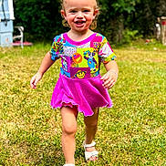 Spencer is registered to the contest to win money with this photo: child, toddler, smiling, running, outdoor, grass, greenery, dress, colorful_clothing, hair_bows, sandals, happy, sunlight, portrait, young_child, playful, nature, daylight, cute, fun