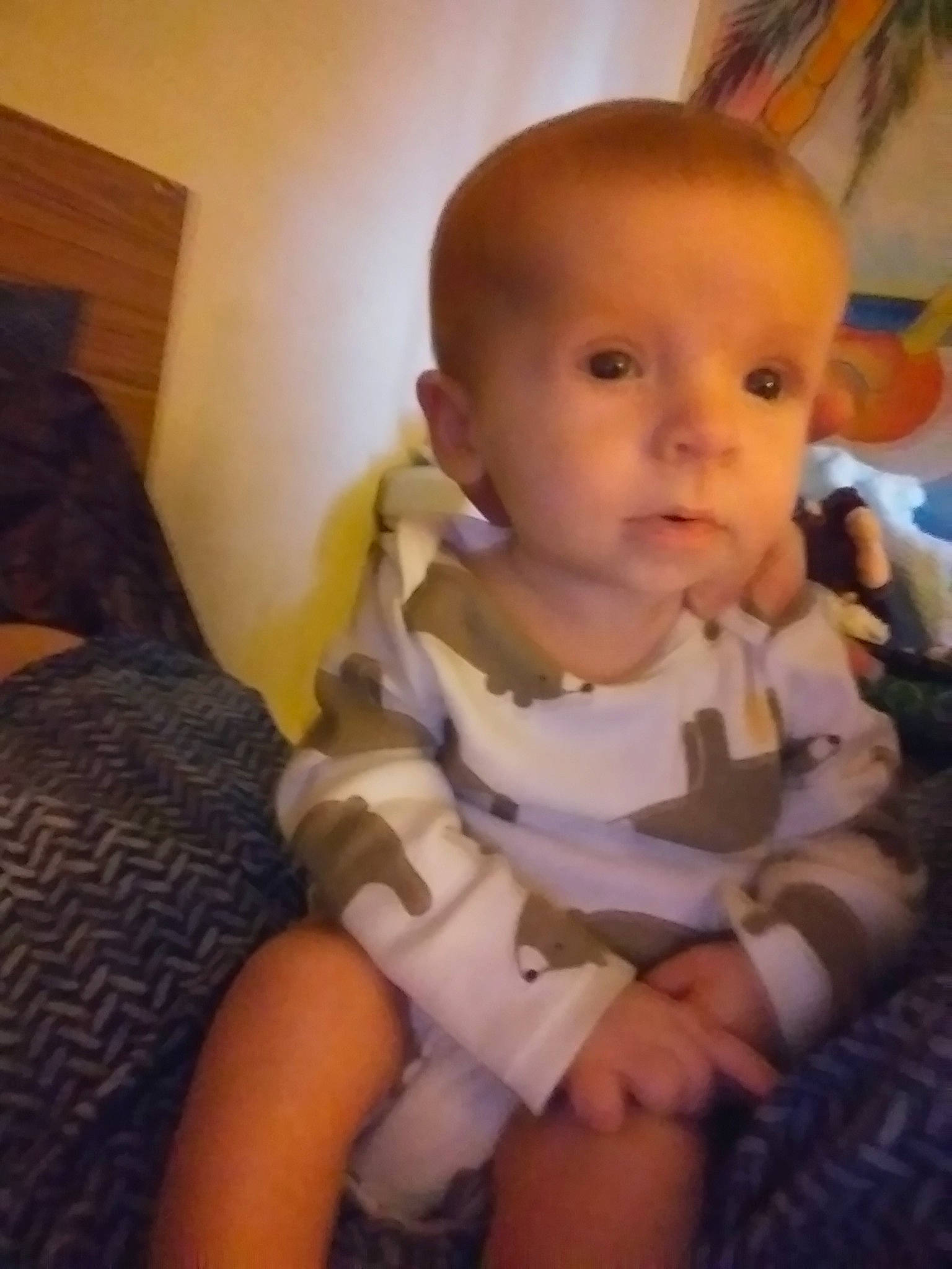 Littleman is registered to the contest to win money with this photo: arm, cheek, child, day, ear, eye, face, finger, hand, head, human_hair_color, infant, iris, leg, mouth, nose, person, product, sitting, skin