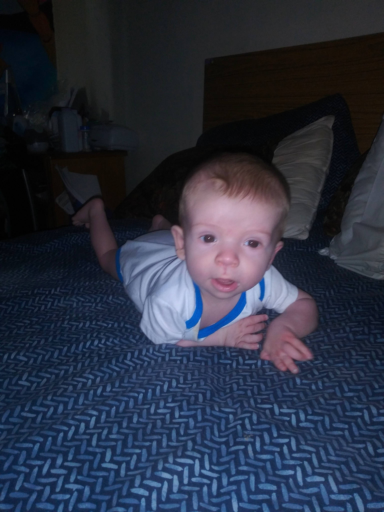 Luke is registered to the contest to win money with this photo: baby, carpet, cheek, child, crawling, eye, face, floor, flooring, fun, head, person, sitting, skin, smile, toddler, tummy_time