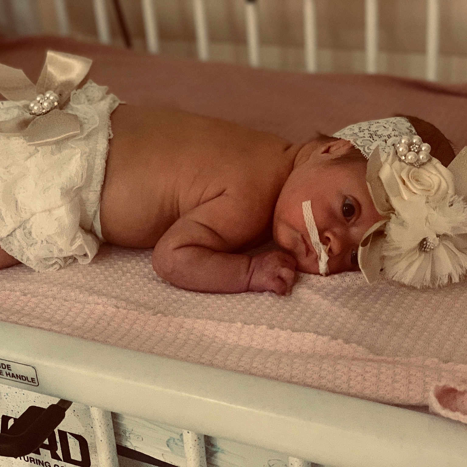 Blakely is registered to the contest to win money with this photo: art, baby, baby_safety, baby_sleeping, bed_sheet, bedding, bedtime, child, comfort, fashion_accessory, flesh, hair_accessory, headgear, headpiece, jewellery, linens, product, room, textile, wood