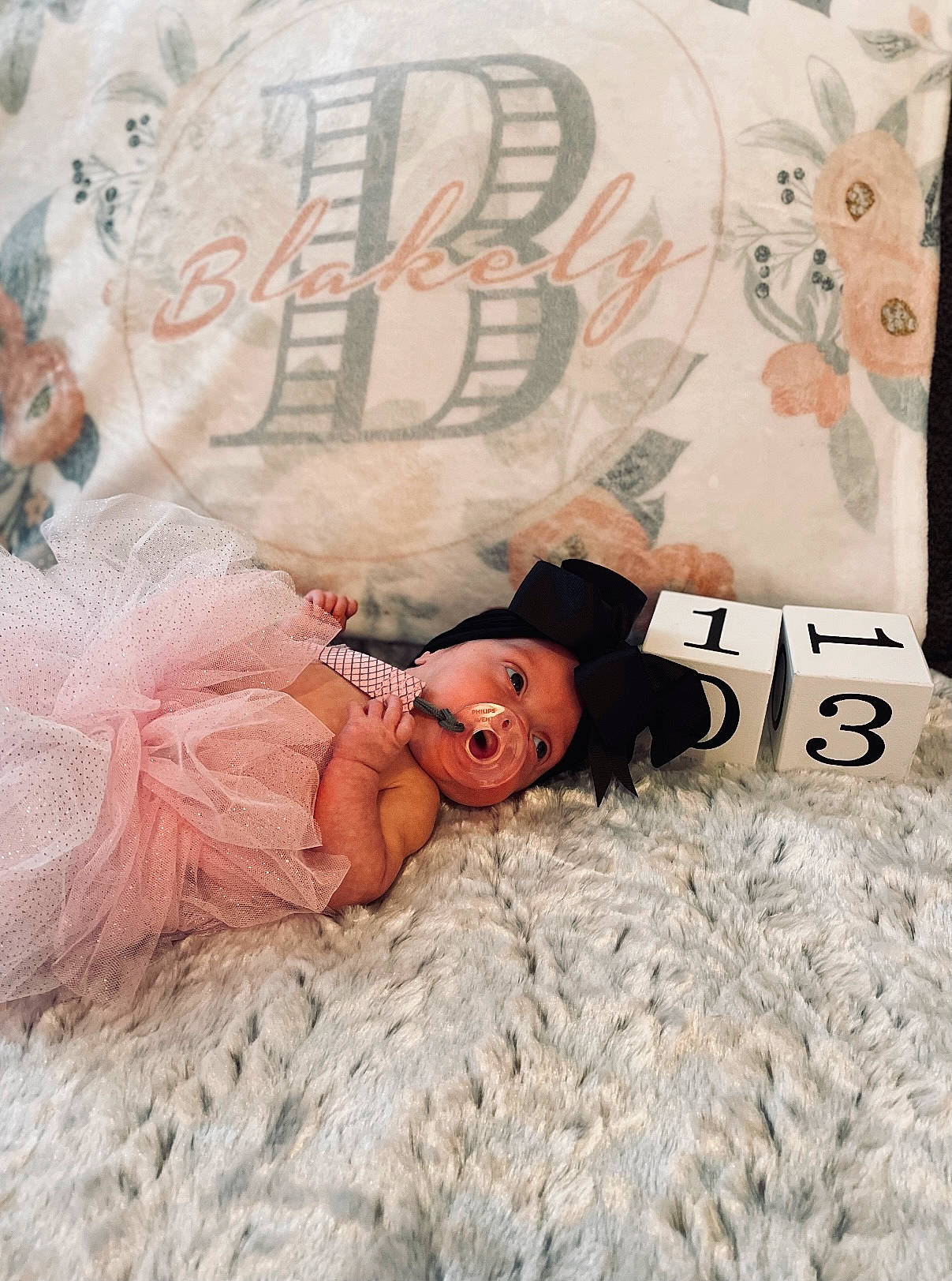 Blakely is registered to the contest to win money with this photo: baby, bed, bed_sheet, bedding, bedtime, child, comfort, font, fun, fur, happy, hat, linens, pattern, peach, person, pink, room, t_shirt, textile
