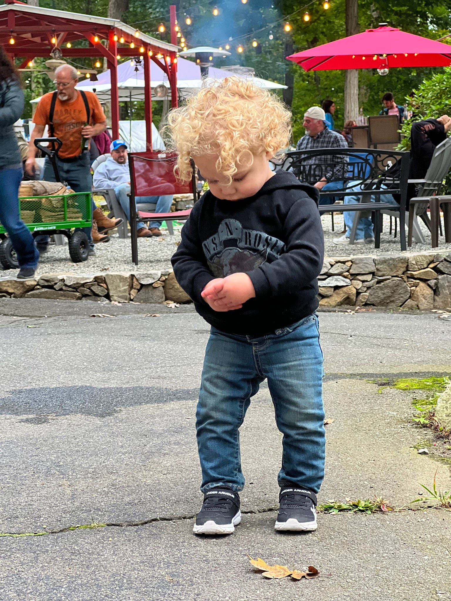 Maverick is registered to the contest to win money with this photo: city, clothing, crowd, event, footwear, fun, headwear, jacket, jeans, leisure, pedestrian, person, plant, recreation, road, road_surface, street, t_shirt, toddler, tree