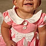 baby, child, smiling, pink_dress, polka_dot, headband, cute, happy, indoors, portrait, infant, dimple, sitting, white_collar, bow, button, face, skin, person, toddler