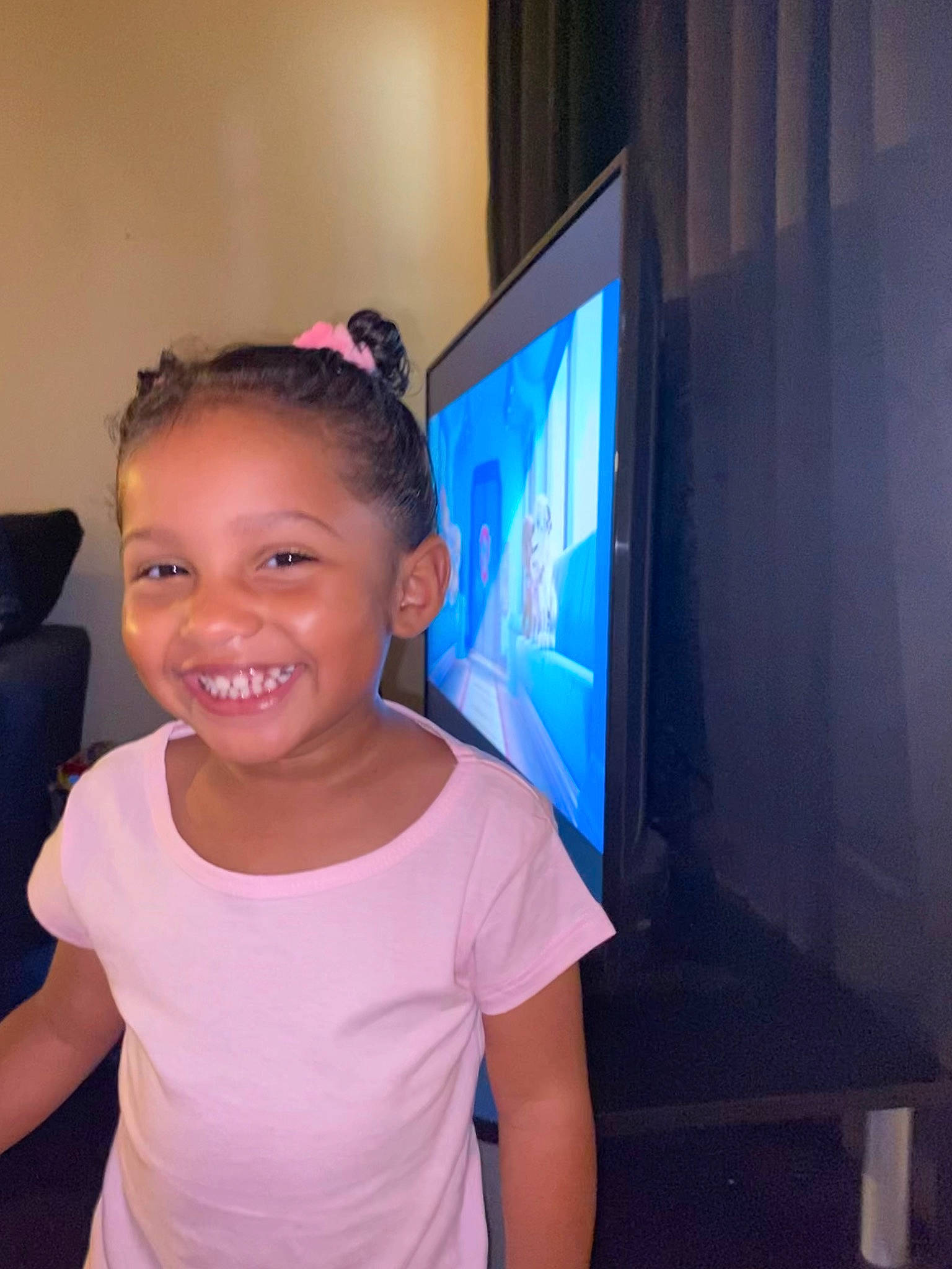 Zariyah is registered to the contest to win money with this photo: audio_equipment, child, electric_blue, electronic_device, event, facial_expression, flat_panel_display, fun, gadget, happy, joy, magenta, output_device, person, purple, shoulder, smile, standing, t_shirt, television