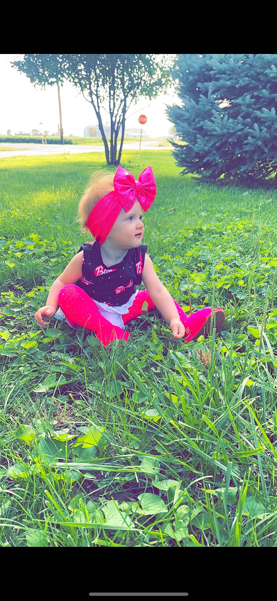 Raighlynn joined the competition — help win amazing prizes! baby, baby_toddler_clothing, costume_hat, grass, grassland, groundcover, happy, hat, headwear, landscape, lawn, leaf, leisure, magenta, meadow, people_in_nature, person, plant, prairie, recreation