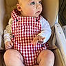 baby, child, infant, cute, blue_eyes, red_checkered_romper, white_shirt, sitting, high_chair, indoor, skin, foot, hand, face, curious, portrait, person, furniture, comfort, young
