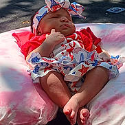 Amoura is registered to the contest to win money with this photo: baby, barefoot, blue_clothing, bow, cushion, feet, headband, infant, legs, outdoor, peaceful, pink_cushion, red_clothing, resting, shadow, skin, sleeping, stars_pattern, sunlight, white_clothing