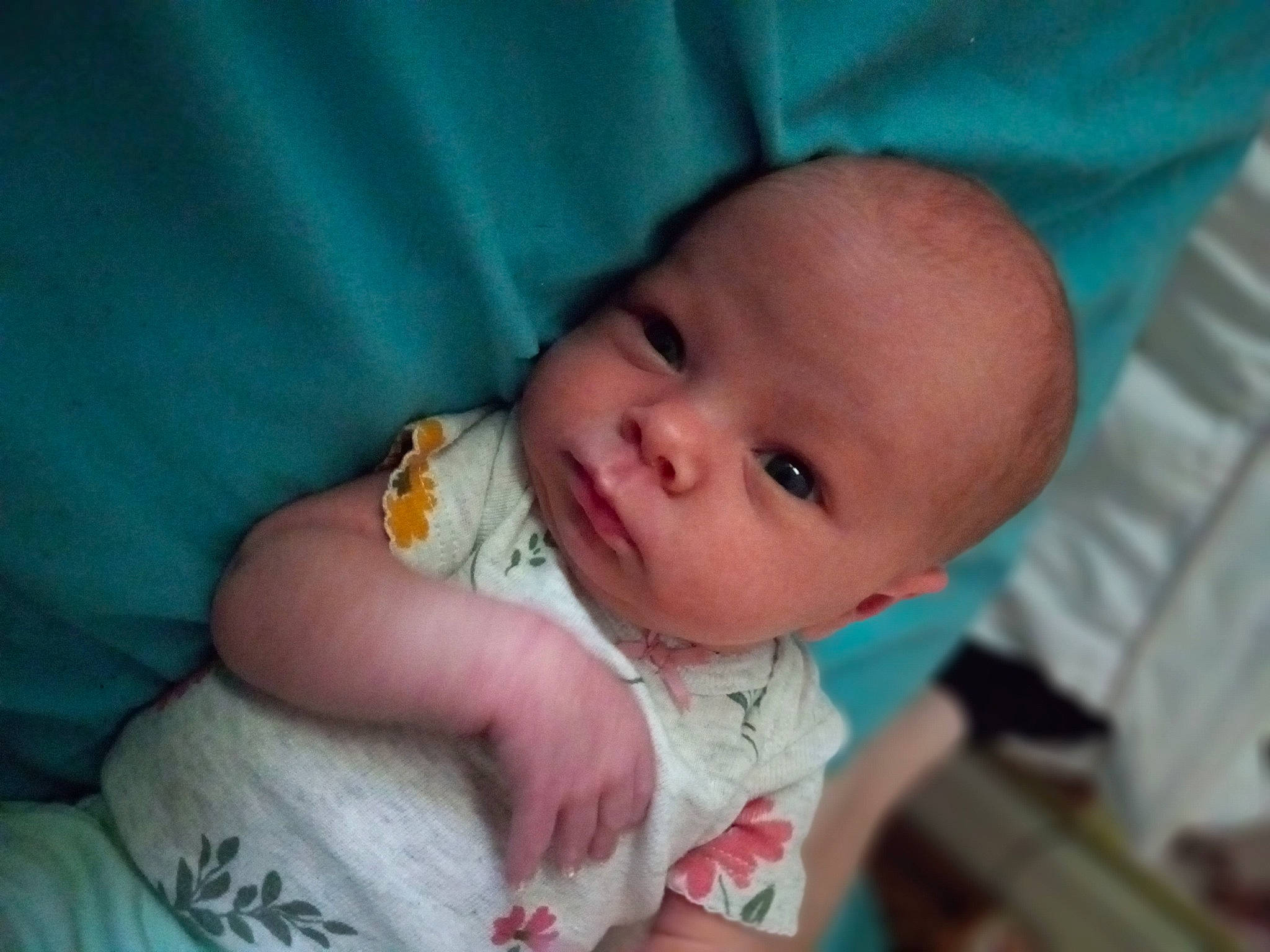 Ruby is registered to the contest to win money with this photo: azure, baby, baby_toddler_clothing, cheek, comfort, dress, ear, eye, finger, happy, human_body, iris, lip, mouth, nose, person, skin, sleeve, textile, thumb