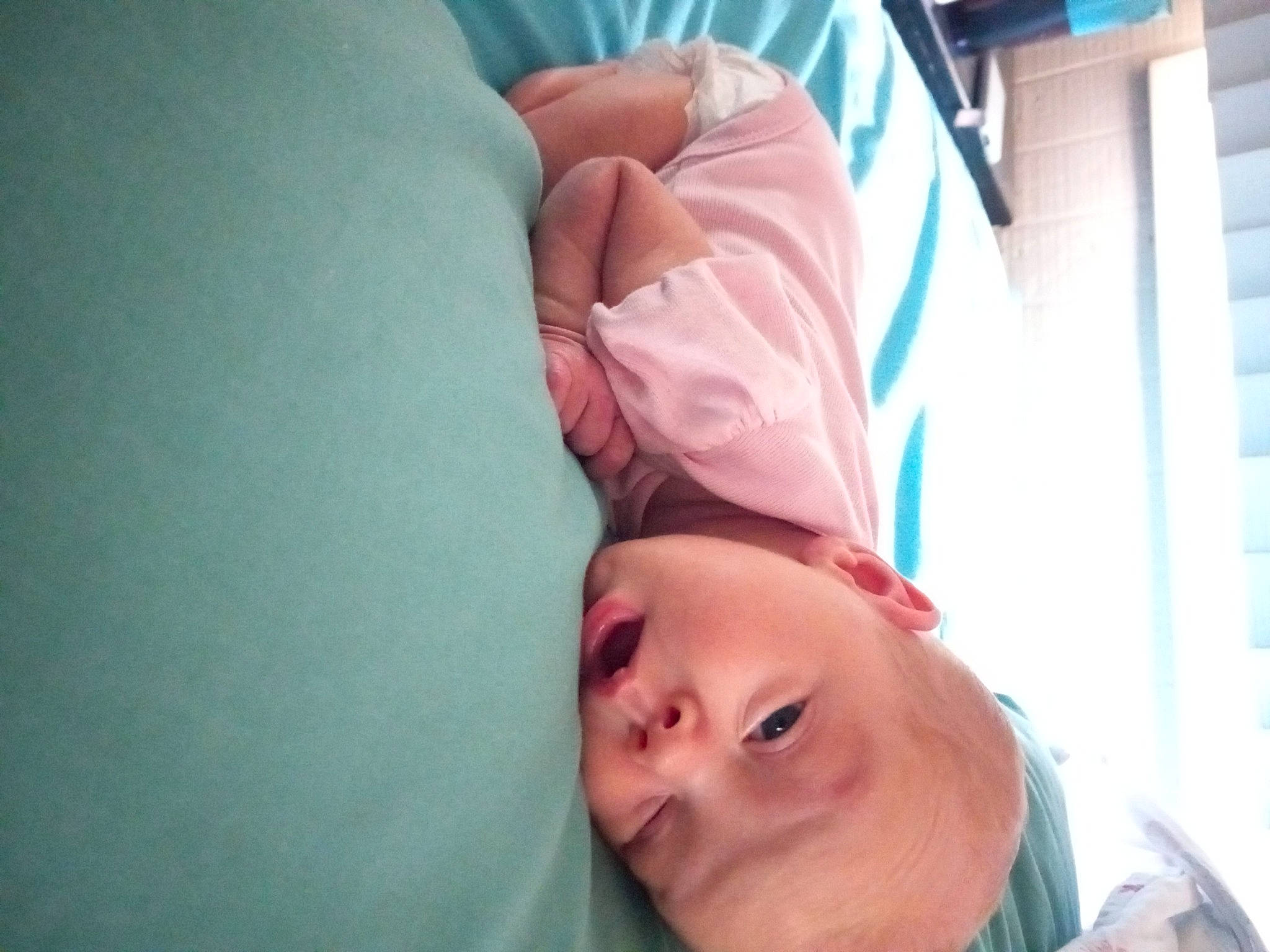 Ruby is registered to the contest to win money with this photo: baby, cheek, child, comfort, eyelash, flesh, fun, gesture, happy, human_leg, linens, magenta, mouth, neck, nose, person, room, skin, smile, t_shirt