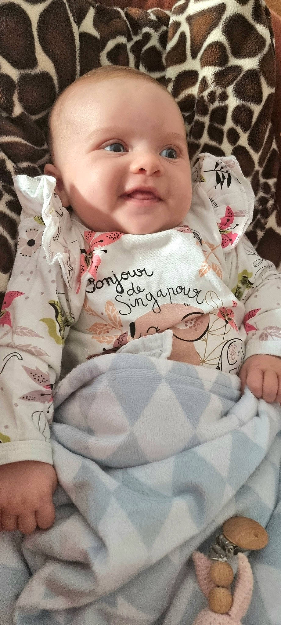 Ella participe au concours pour gagner de l'argent avec cette photo : arm, baby_toddler_clothing, cheek, comfort, eye, face, facial_expression, head, human, lip, mouth, organ, outerwear, person, photograph, product, skin, sleeve, smile, textile