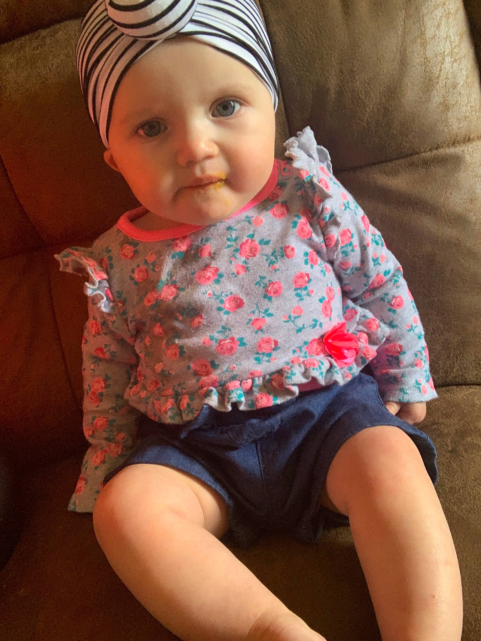 Chloe is registered to the contest to win money with this photo: baby, cheek, child, head, headgear, headwear, leg, person, sitting, skin, toddler