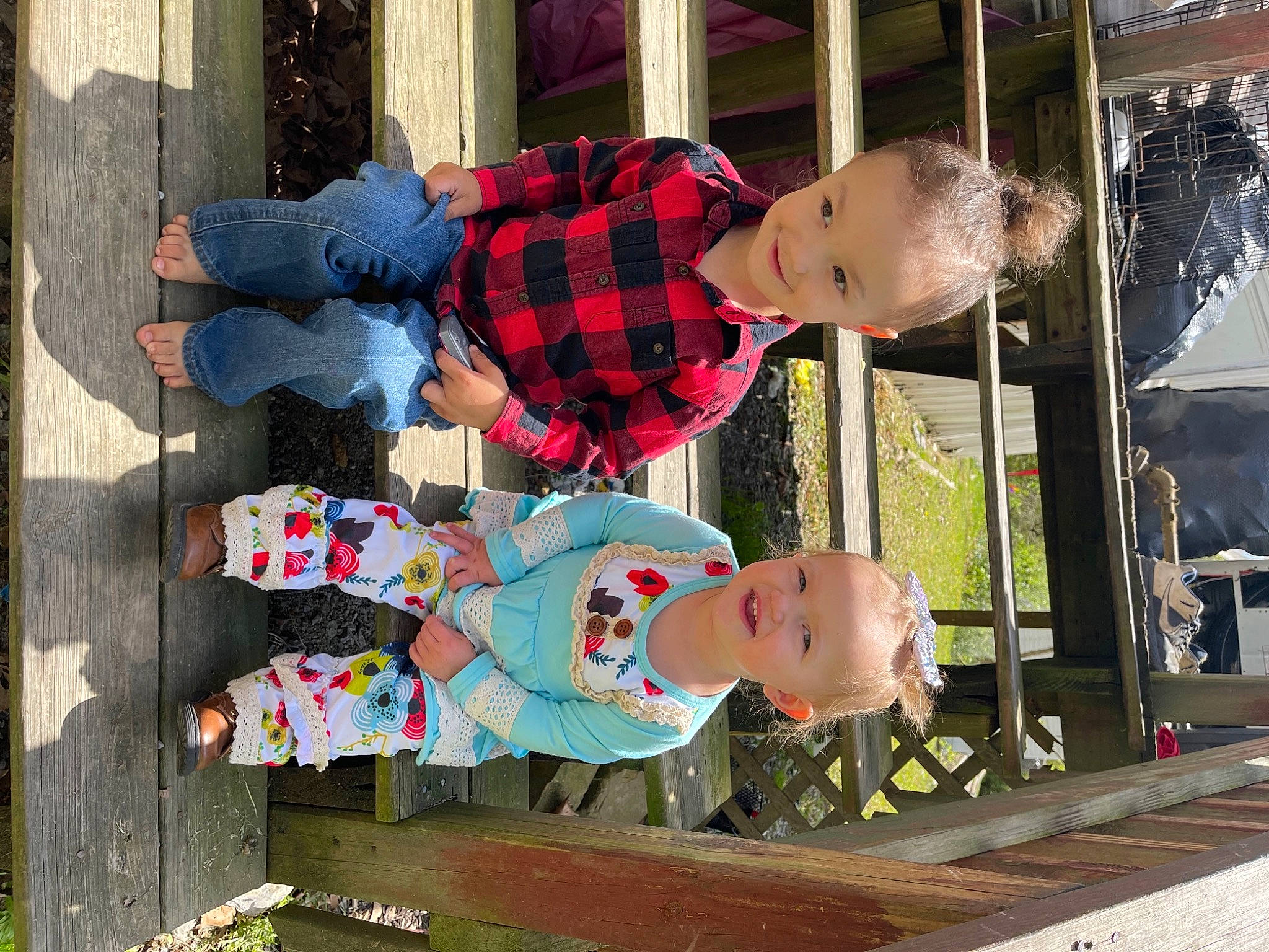 Chloe Ealy is registered to the contest to win money with this photo: baby_toddler_clothing, child, design, fun, green, joy, leisure, pattern, person, photograph, plaid, product, red, sleeve, street_fashion, tartan, textile, toddler, travel, tree