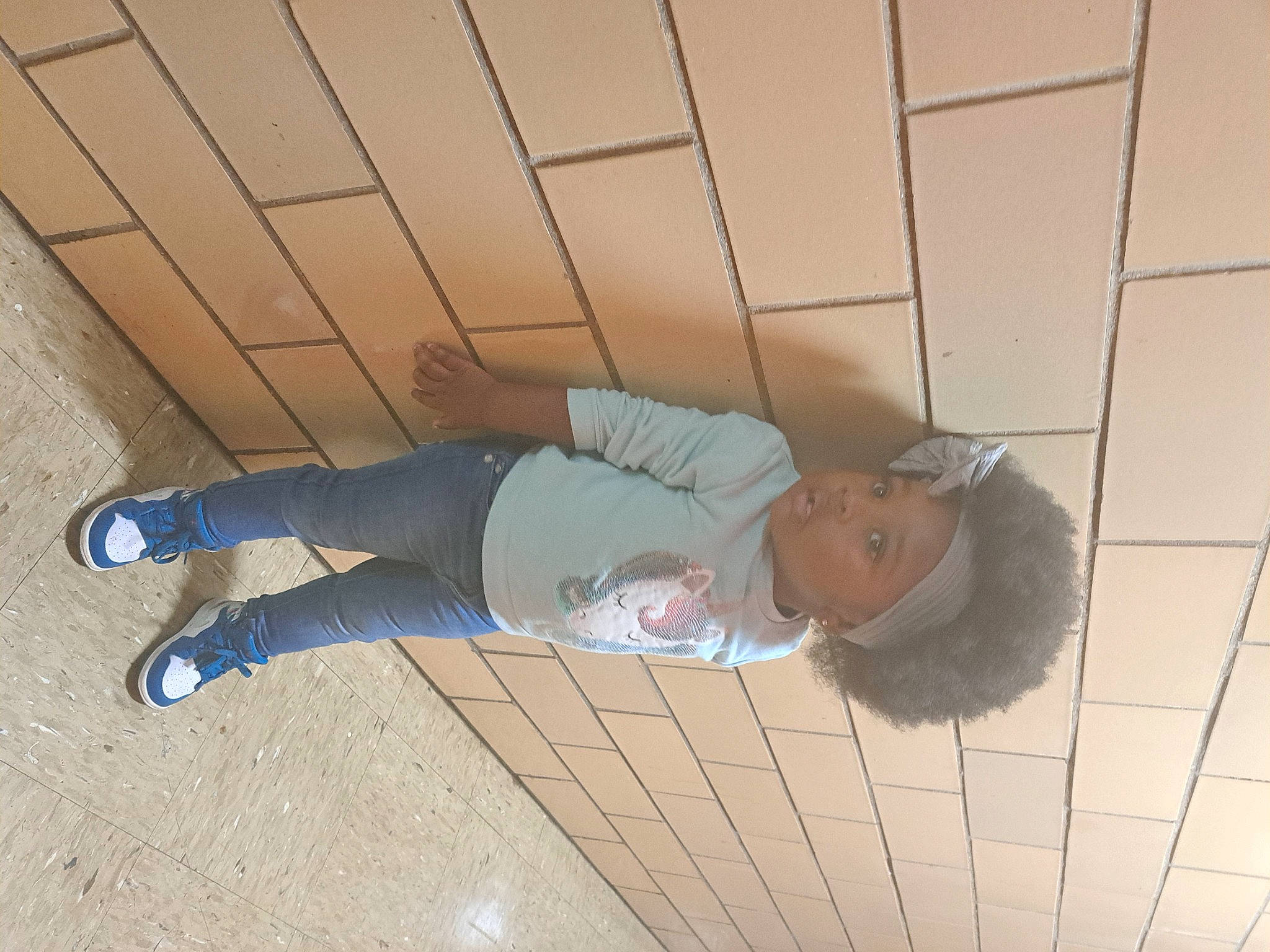 Jo'Nova is registered to the contest to win money with this photo: baby, ceiling, child, comfort, concrete, floor, flooring, foot, fun, hardwood, headwear, human_leg, pattern, person, shadow, sneakers, sock, tile, toddler, walking_shoe